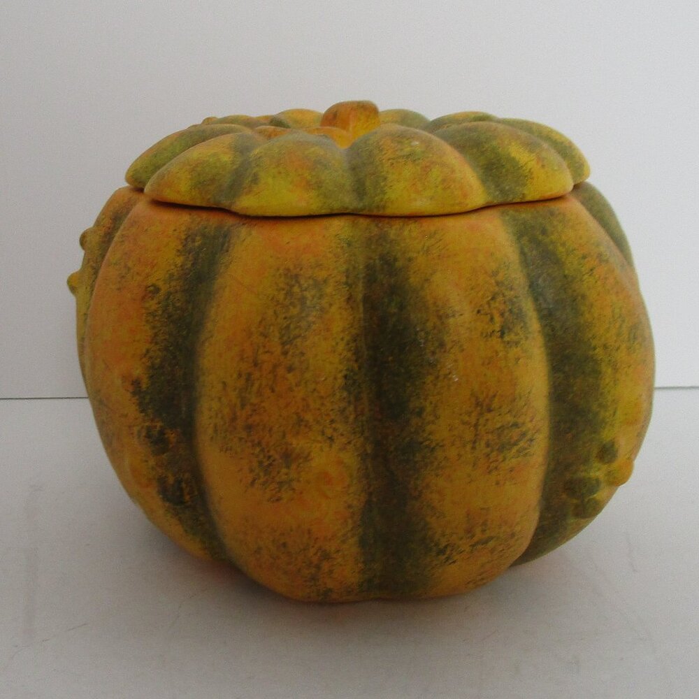 small ceramic pumpkin with candle